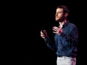 Photo of Or Fridman, while speaking on stage.